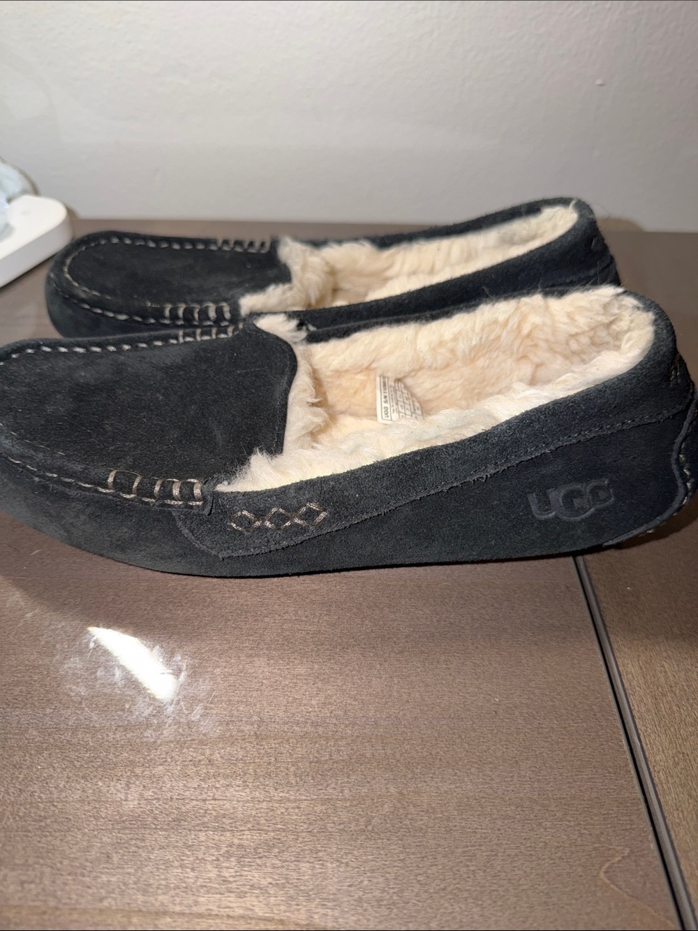 UGG Black Suede Moccasin Slippers with Cream Shearling Lining